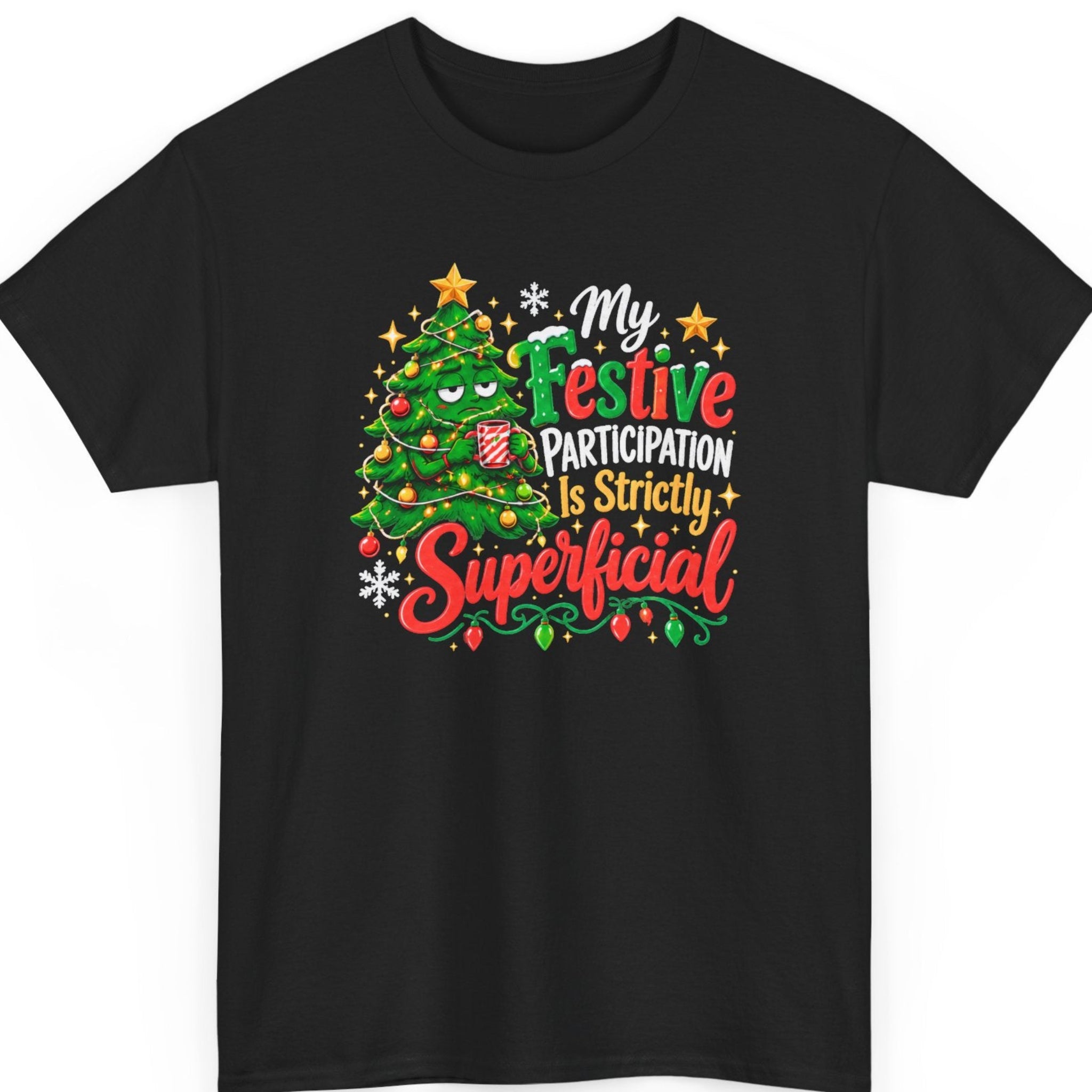 Mayhem Haus “My Festive Participation Is Strictly Superficial” black t-shirt featuring a sarcastic cartoon Christmas tree with an unimpressed expression, holding a red-and-white striped mug, surrounded by ornaments, Christmas lights, gold stars, snowflakes, and bold red, green, white, and gold holiday typography.