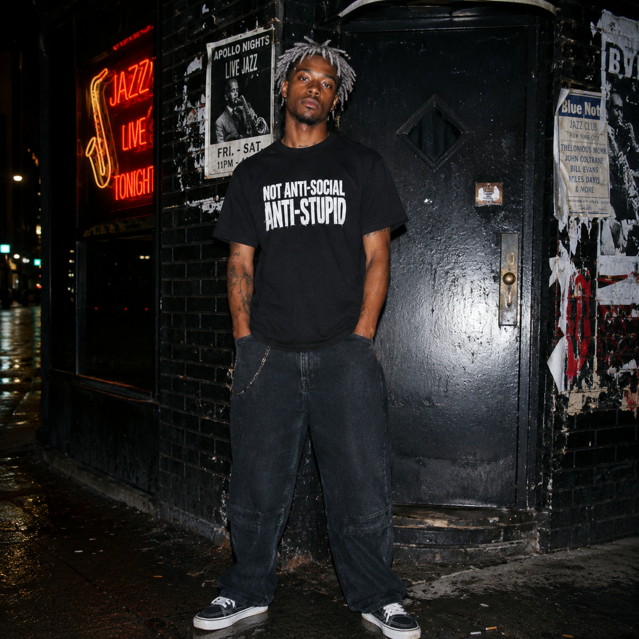 Mayhem Haus Not Anti-Social Anti-Stupid T-Shirt on a person in front of a jazz club