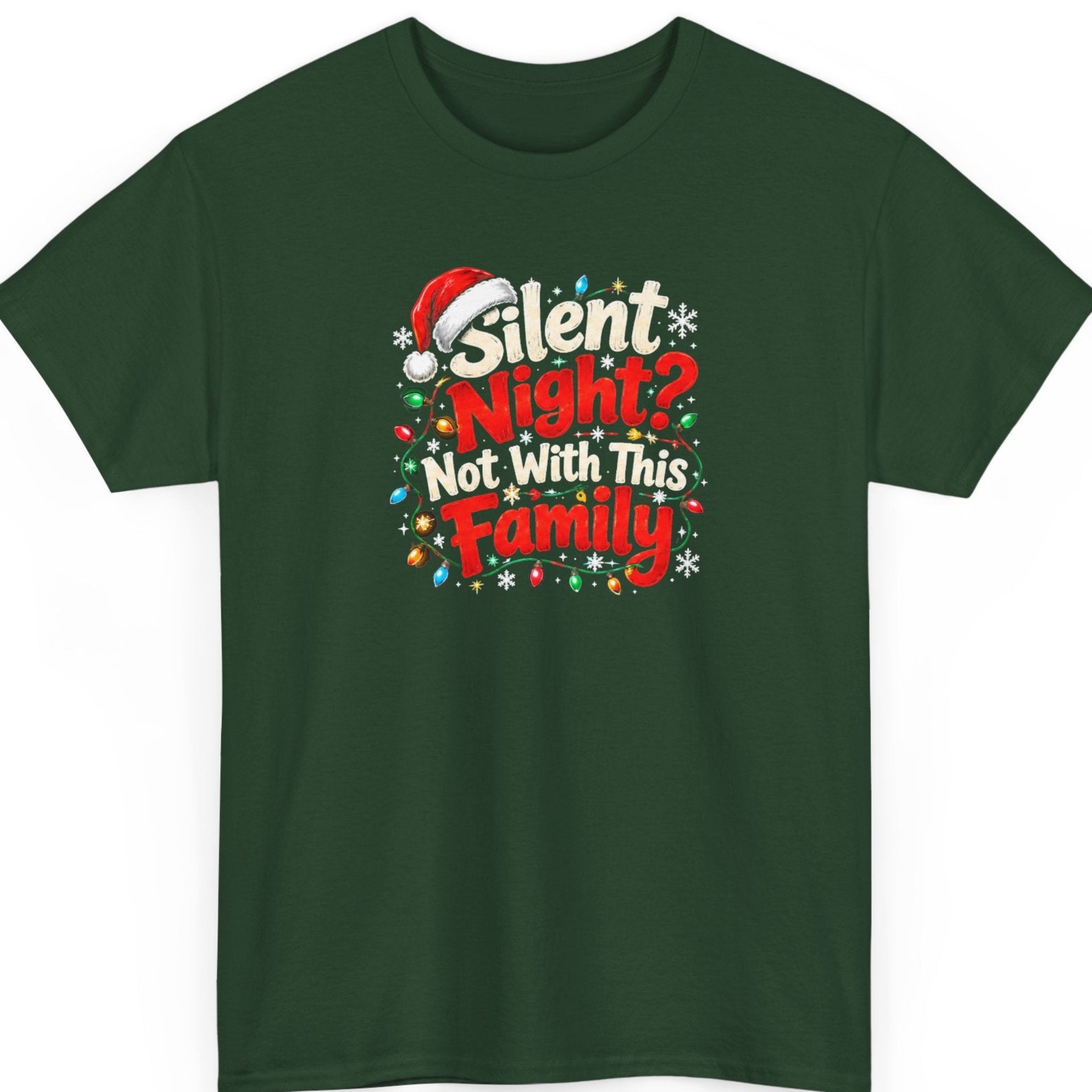 Mayhem Haus “Silent Night? Not With This Family” forest green t-shirt featuring festive red and cream-white typography with a red Santa hat resting above the lettering, surrounded by multicolored Christmas string lights and white snowflakes.
