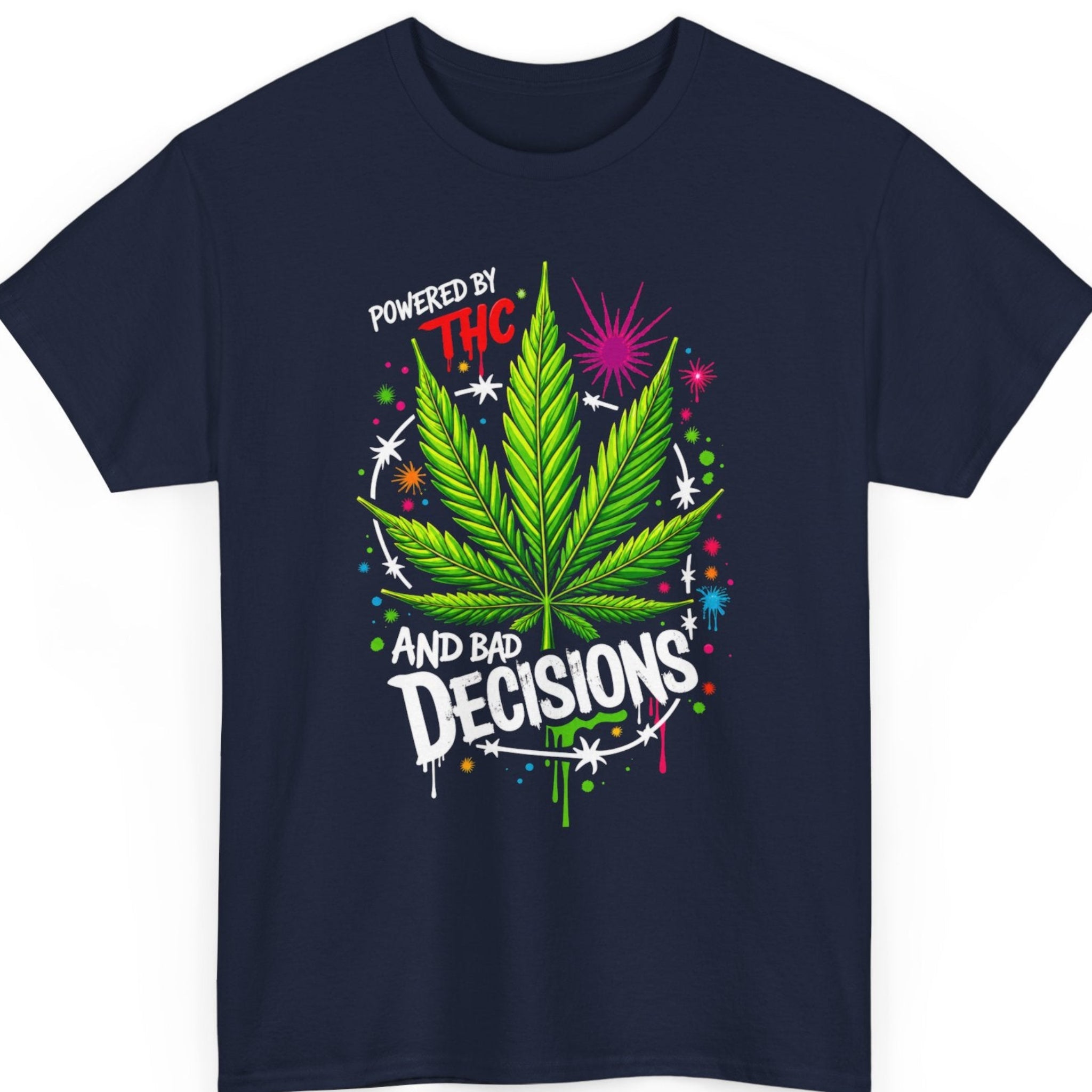 Mayhem Haus weed graphic tee on a navy blue shirt featuring a bright cannabis leaf, colorful paint splashes, and bold typography reading "Powered By THC And Bad Decisions."