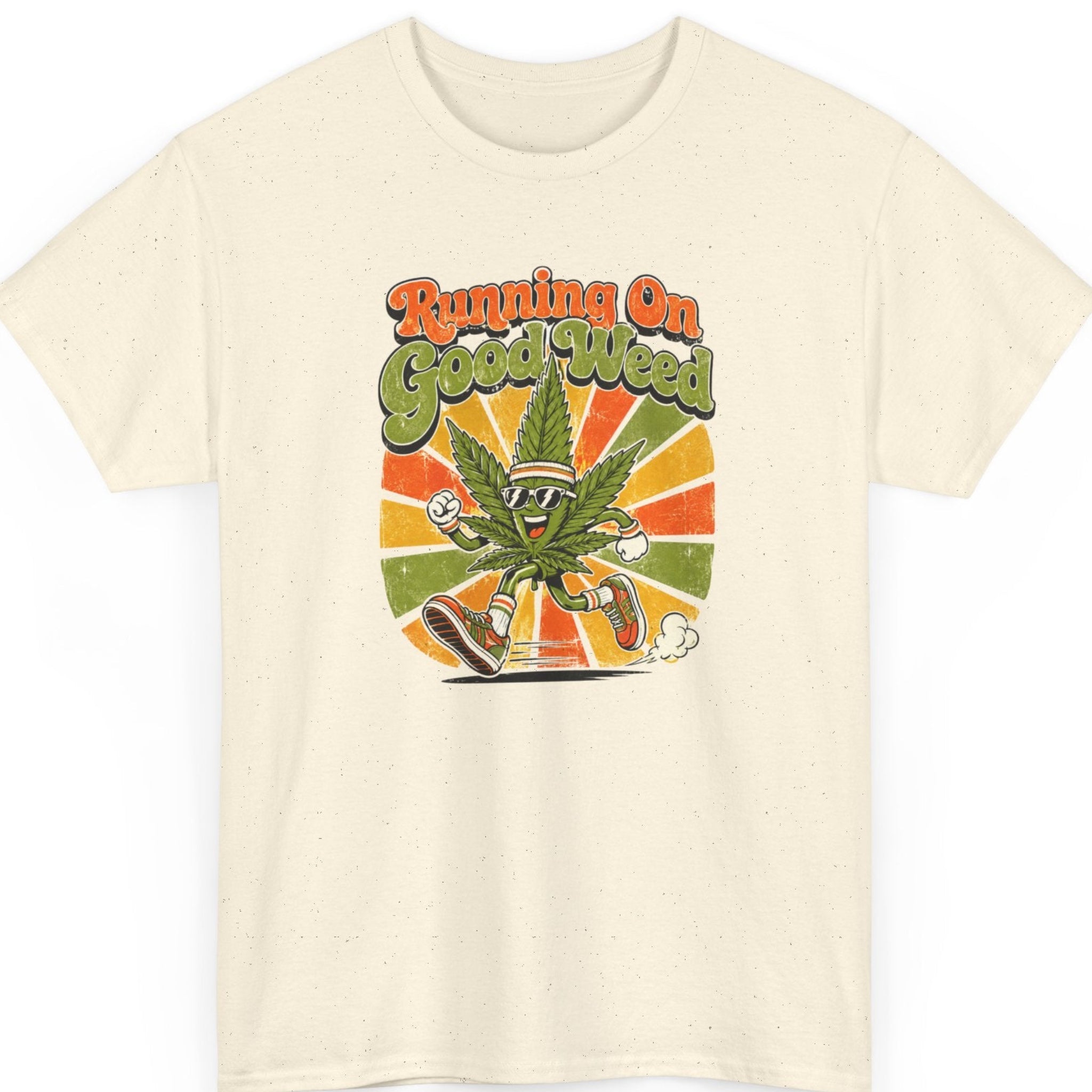 Mayhem Haus novelty cannabis t-shirt on a natural shirt featuring a smiling marijuana leaf mascot in running gear against a retro sunset with the phrase "Running On Good Weed."