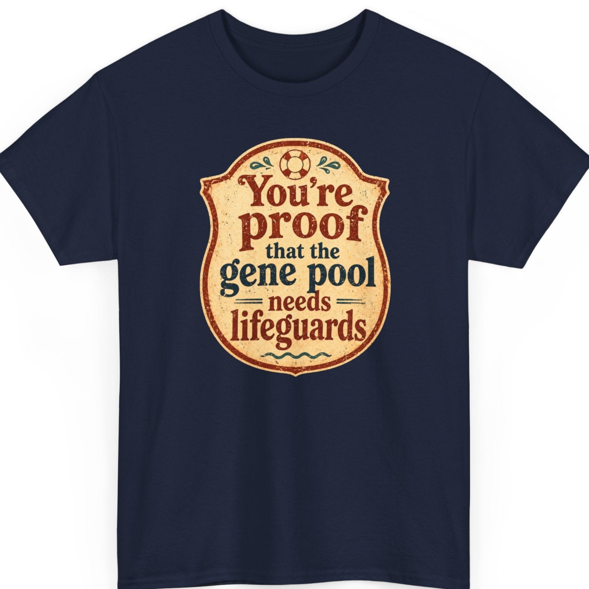 Mayhem Haus funny insult graphic tee on a navy blue shirt featuring an aged lifeguard badge design with distressed vintage typography and the phrase "You're Proof That The Gene Pool Needs Lifeguards."