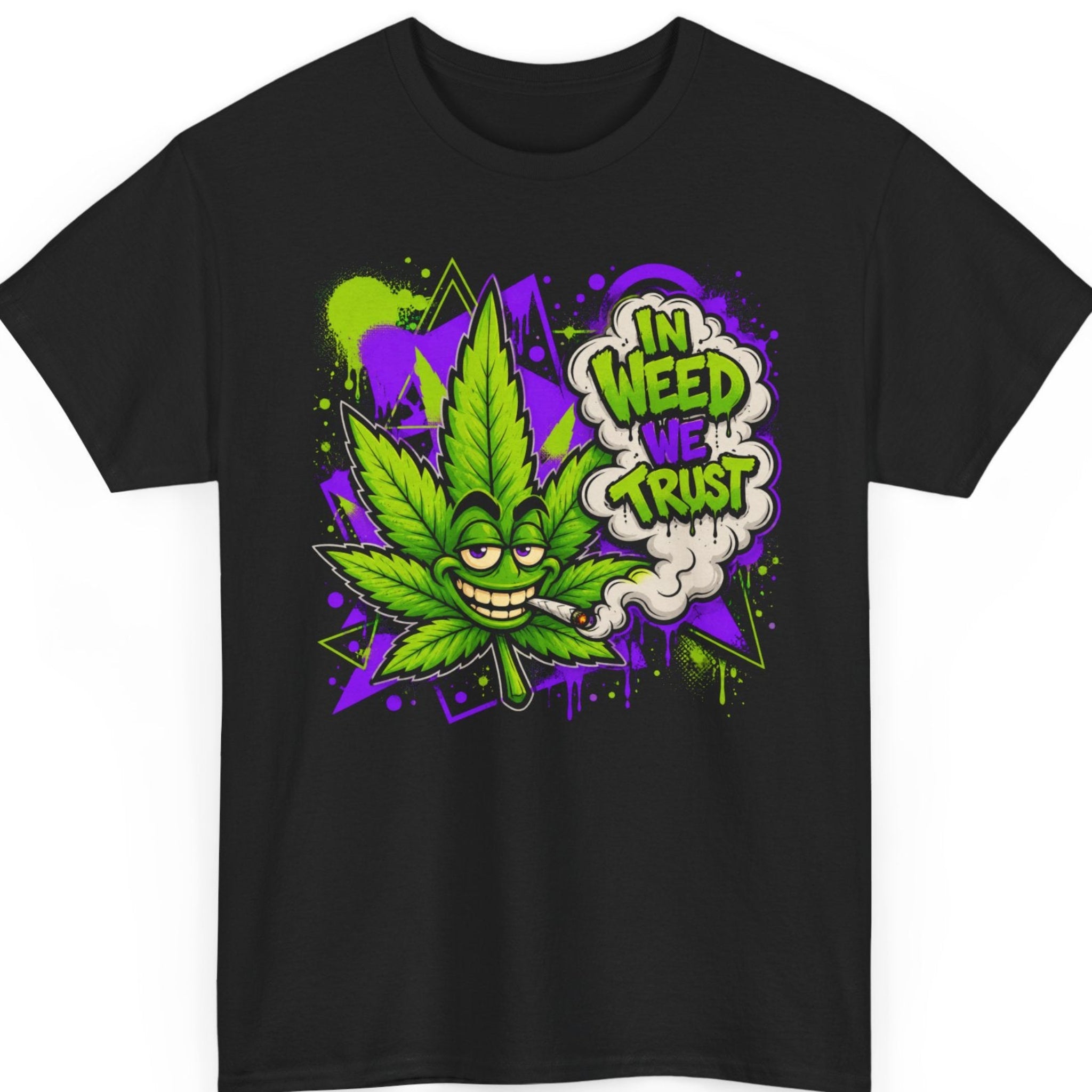 Mayhem Haus "In Weed We Trust" graphic t-shirt on a black shirt featuring a mischievous cartoon cannabis leaf with a lit joint, graffiti-style purple and green paint splatters, and smoke spelling out "In Weed We Trust."
