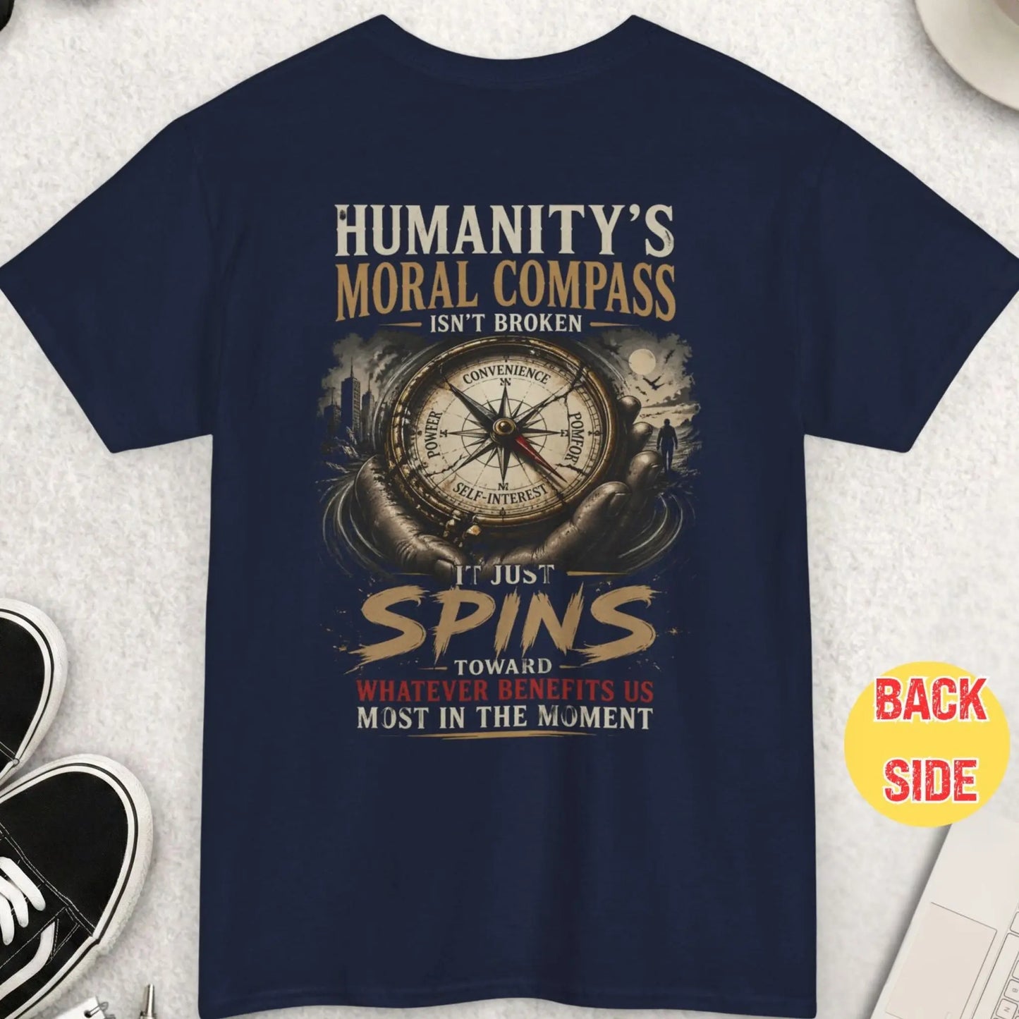 Navy blue t-shirt showing philosophical compass design with words power, convenience, comfort, and self interest with bold moral message