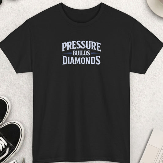 Black t-shirt with bold distressed text “Pressure Builds Diamonds” motivational graphic design