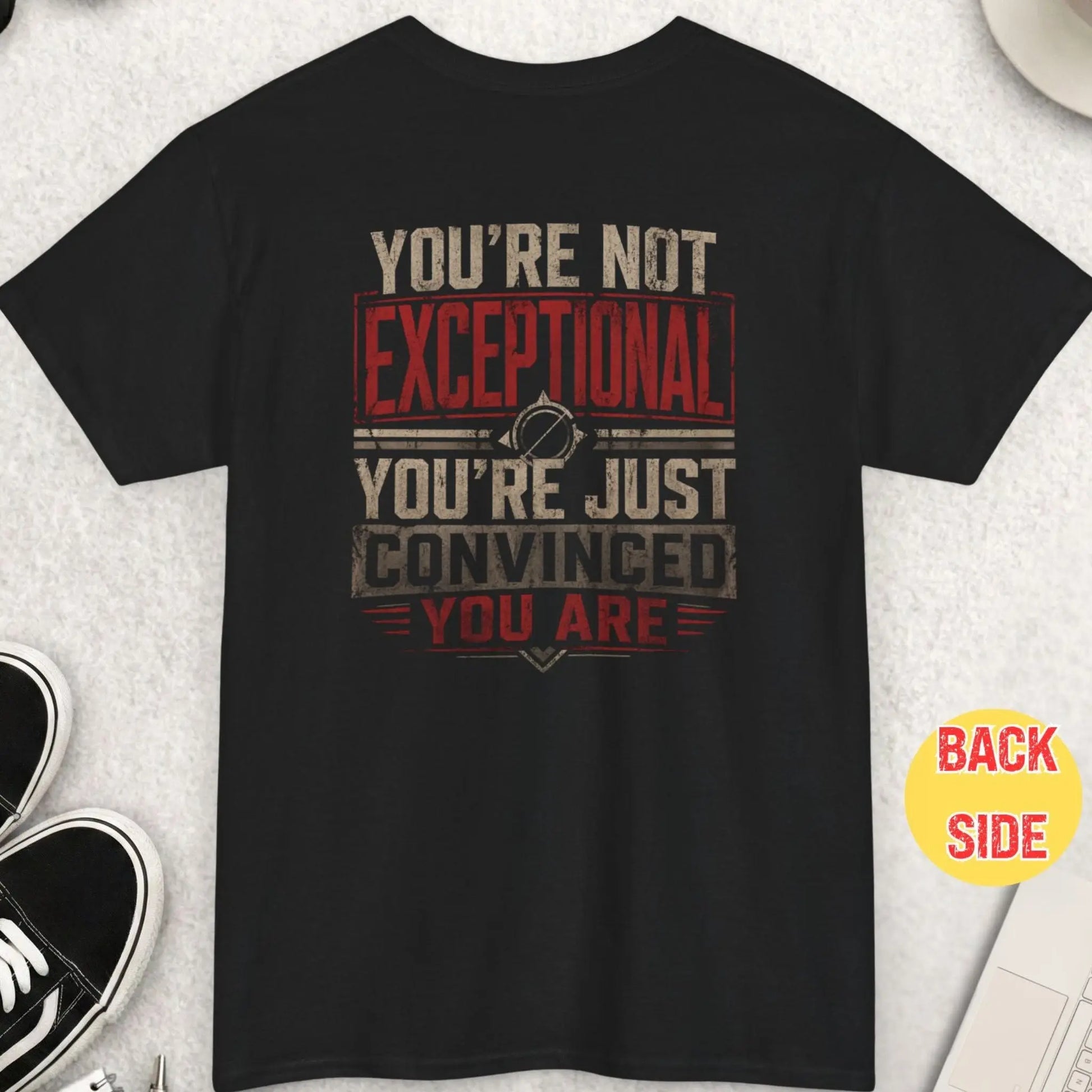 Black t-shirt with bold distressed typography reading “You’re Not Exceptional You’re Just Convinced You Are” in a high-contrast vintage red and cream design.