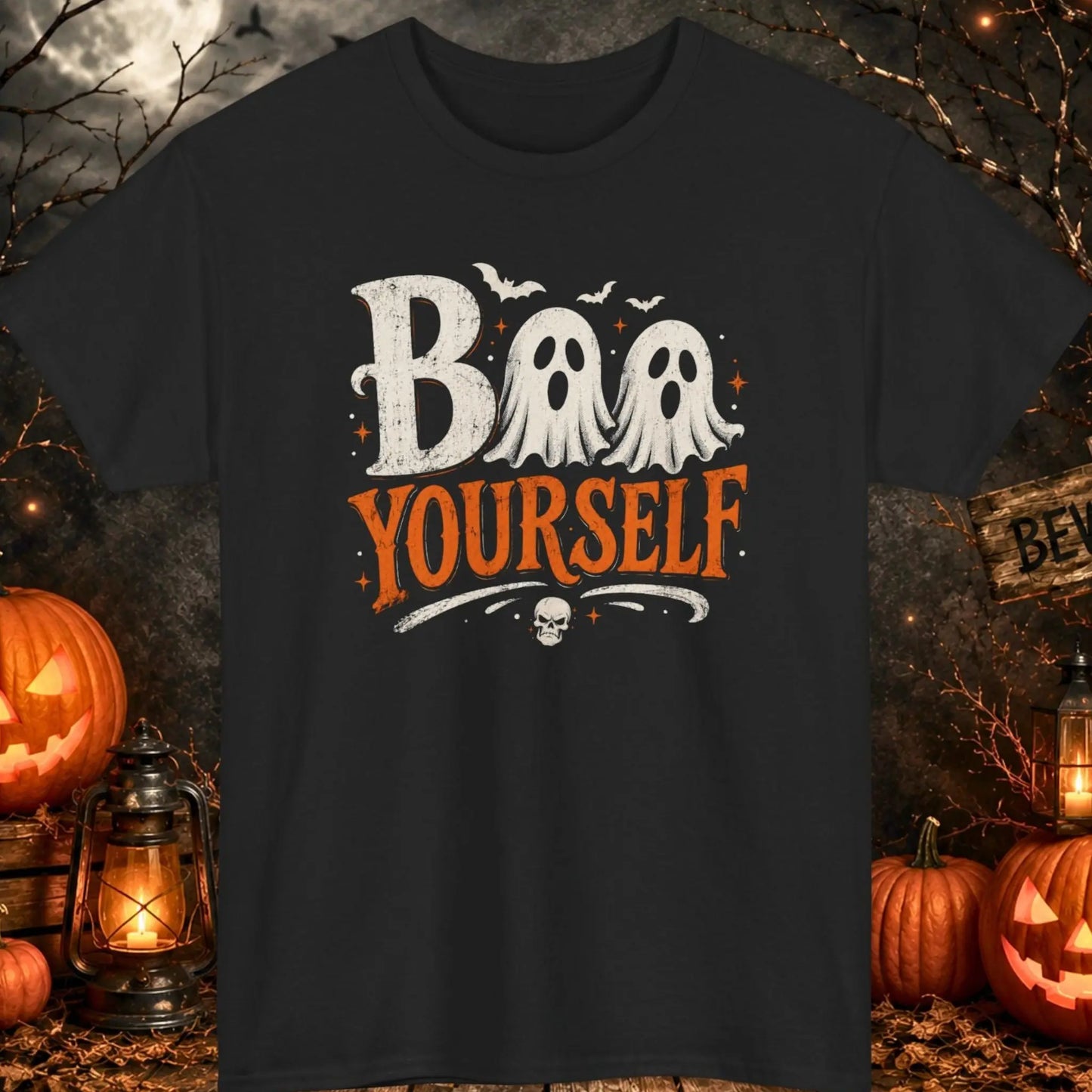 Cute Halloween ghost graphic t-shirt featuring two friendly ghosts and the phrase "Boo Yourself" in distressed vintage typography on a black shirt, perfect for spooky season, Halloween parties, ghost lovers, and fall festivals.