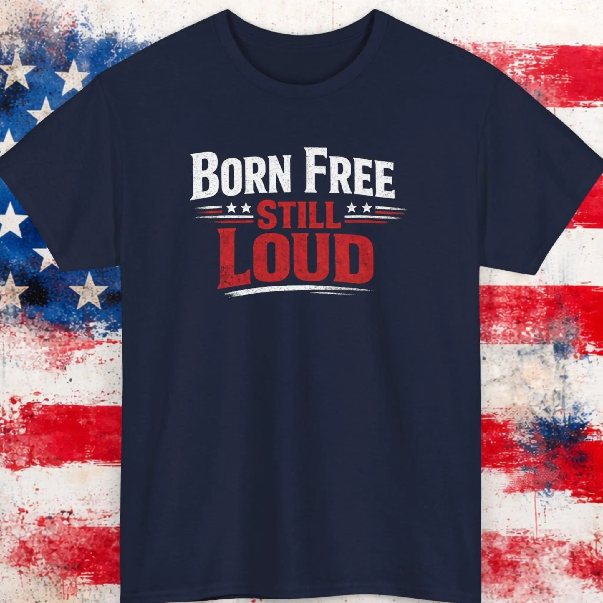 Mayhem Haus Born Free Still Loud T-Shirt in navy blue with red and white text on a distressed US flag background