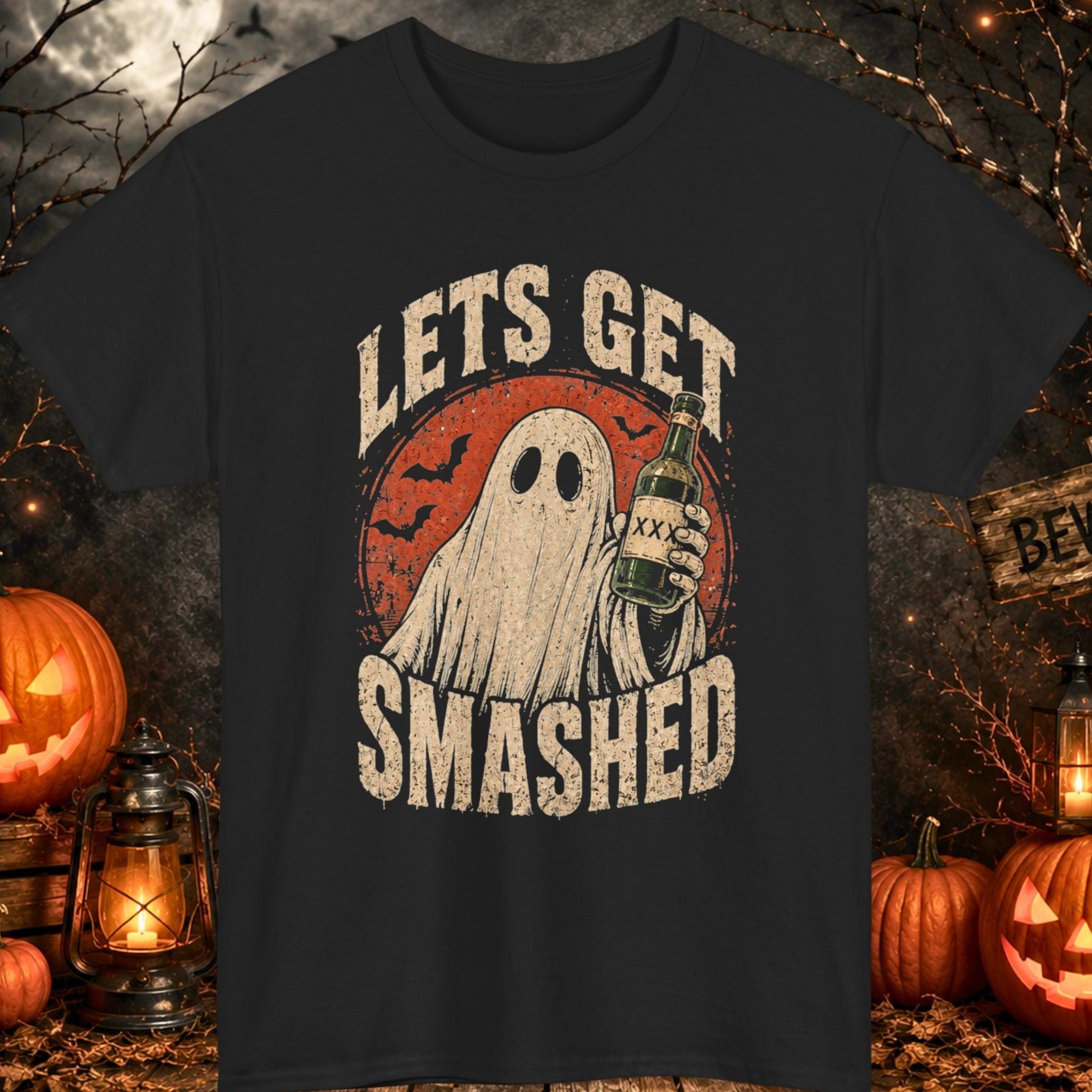Mayhem Haus black Halloween T-shirt featuring a distressed vintage-style ghost holding a bottle beneath the phrase "Let's Get Smashed." The retro Halloween graphic combines spooky imagery and drinking humor, making it perfect for Halloween parties, brewery visits, bar crawls, Oktoberfest celebrations, and fall events.
