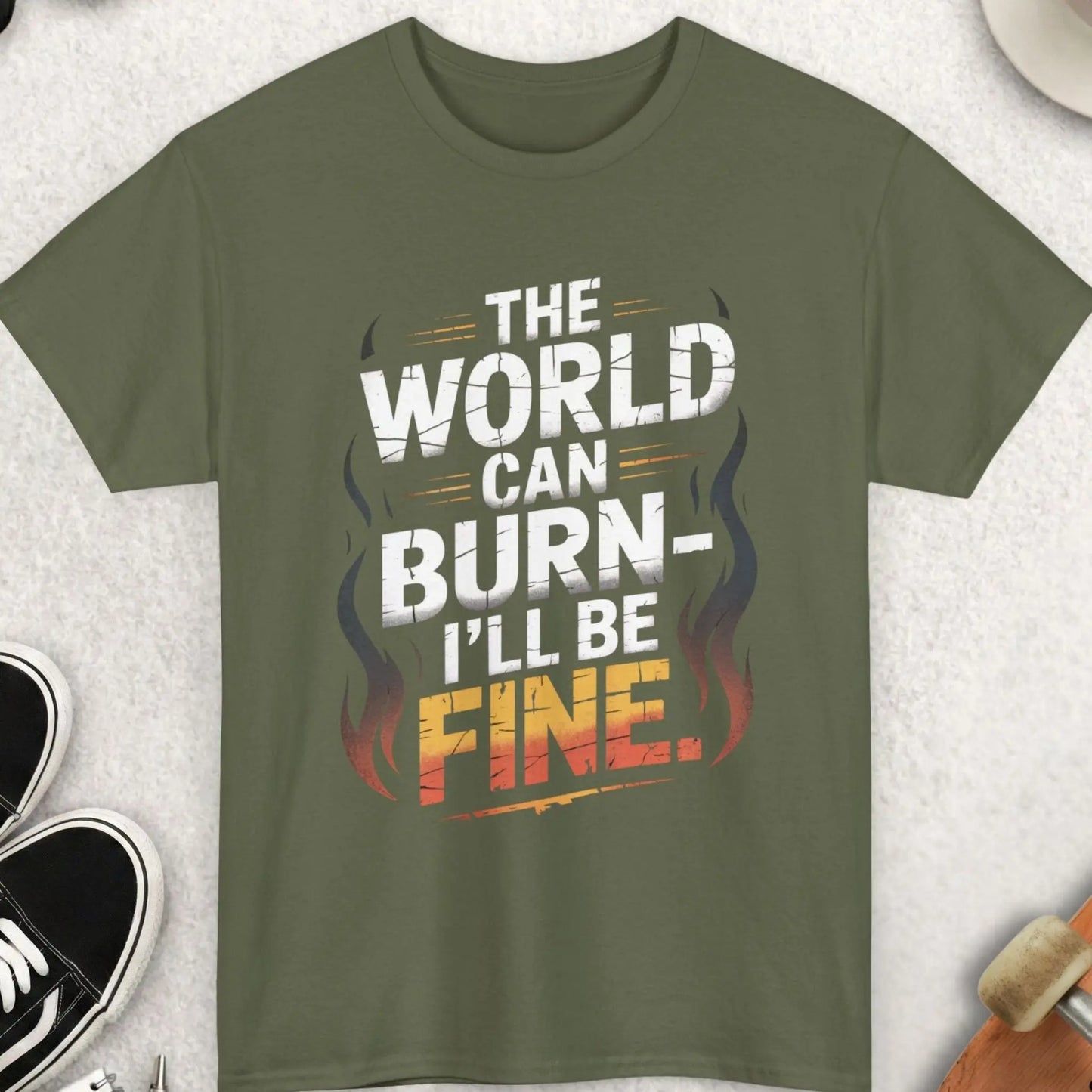 Green t-shirt with a humorous quote on a light gray surface with accessories around.