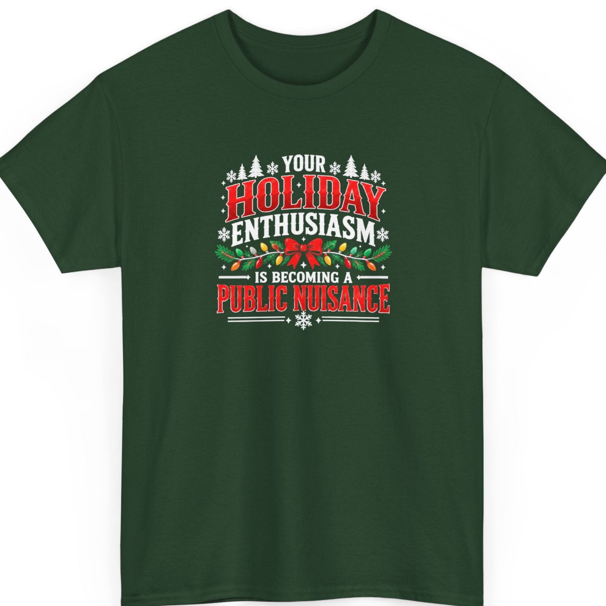 Mayhem Haus “Your Holiday Enthusiasm Is Becoming a Public Nuisance” forest green t-shirt featuring bold red and white holiday lettering, evergreen branches wrapped in colorful Christmas lights, a red bow, white snowflakes, and decorative Christmas trees.