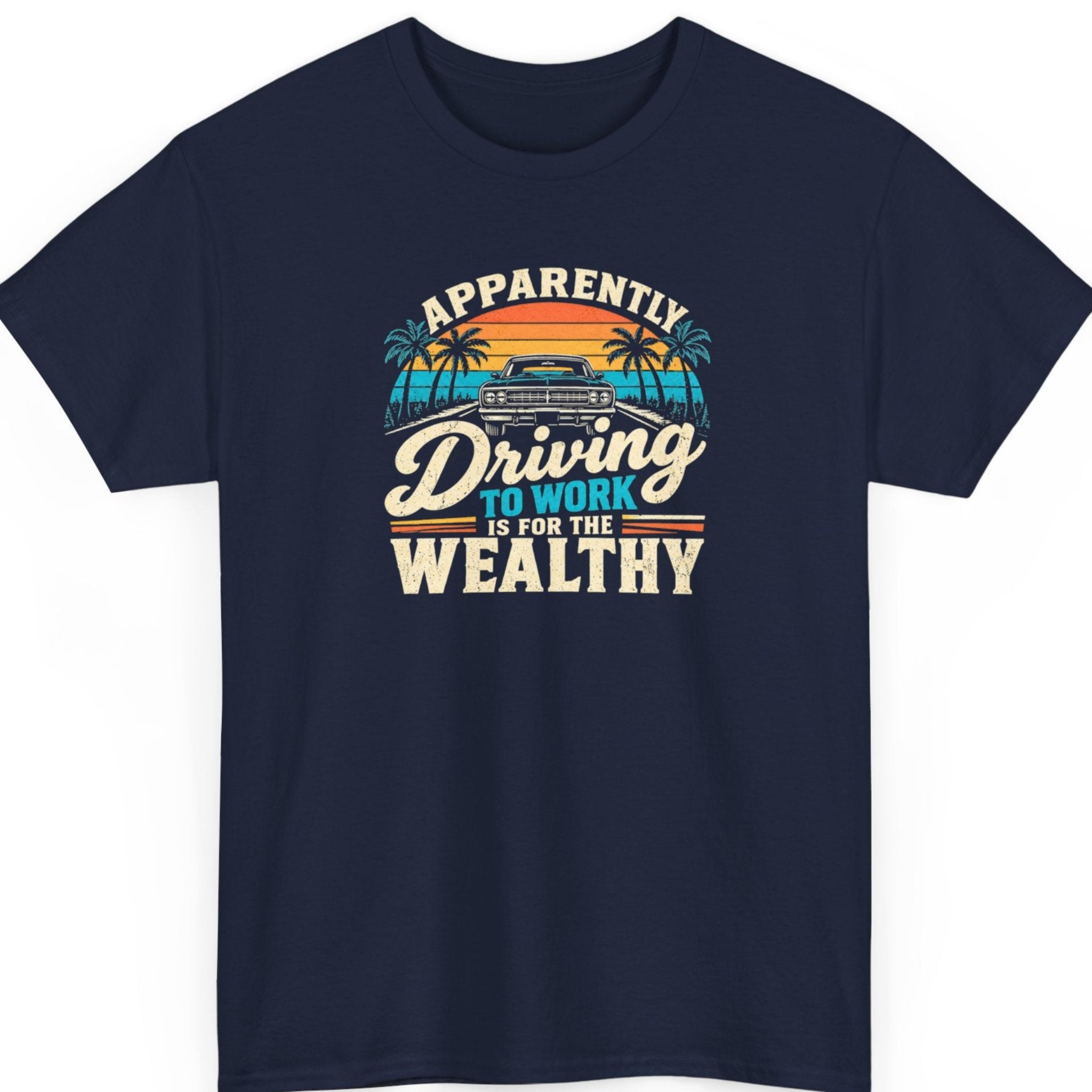 Mayhem Haus “Apparently Driving to Work Is for the Wealthy” navy blue t-shirt featuring a retro muscle car, tropical palm trees, a striped sunset, and distressed cream typography.