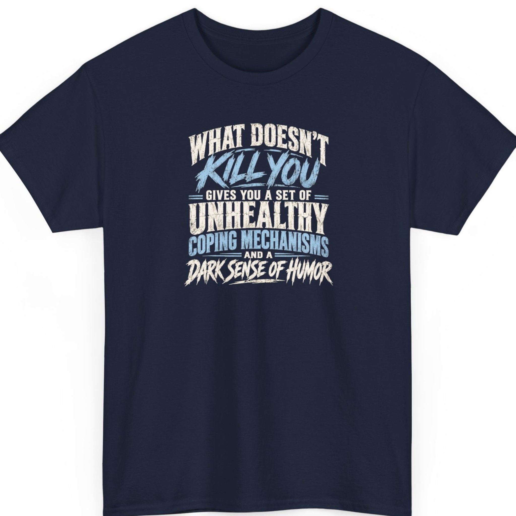 Mayhem Haus “What Doesn't Kill You” navy blue t-shirt featuring bold distressed lettering in white and light blue, with a darkly humorous statement about unhealthy coping mechanisms and a dark sense of humor.