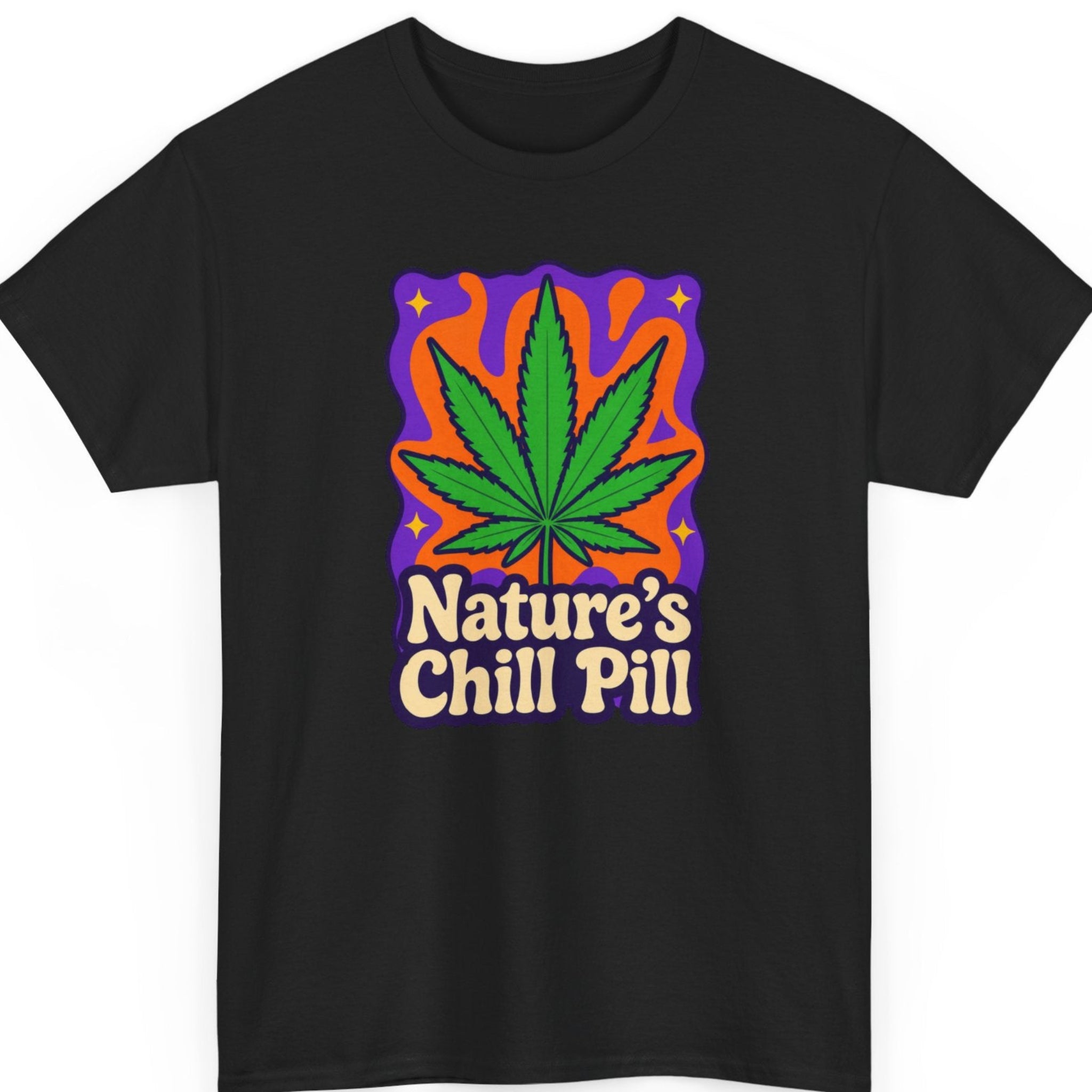Mayhem Haus cannabis graphic t-shirt on a black shirt featuring a bold green marijuana leaf against a vibrant retro orange and purple background with the phrase "Nature's Chill Pill" in vintage cream lettering.