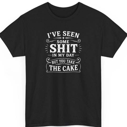 Mayhem Haus sarcastic typography t-shirt on a black shirt featuring distressed white vintage lettering that reads "I've Seen Some Shit In My Day... But You Take The Cake" with decorative flourishes in a clean, high-contrast text-only design.