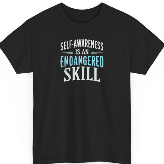 Mayhem Haus "Self-Awareness Is An Endangered Skill" graphic t-shirt on a black shirt featuring distressed white and blue typography in a bold stacked minimalist design.