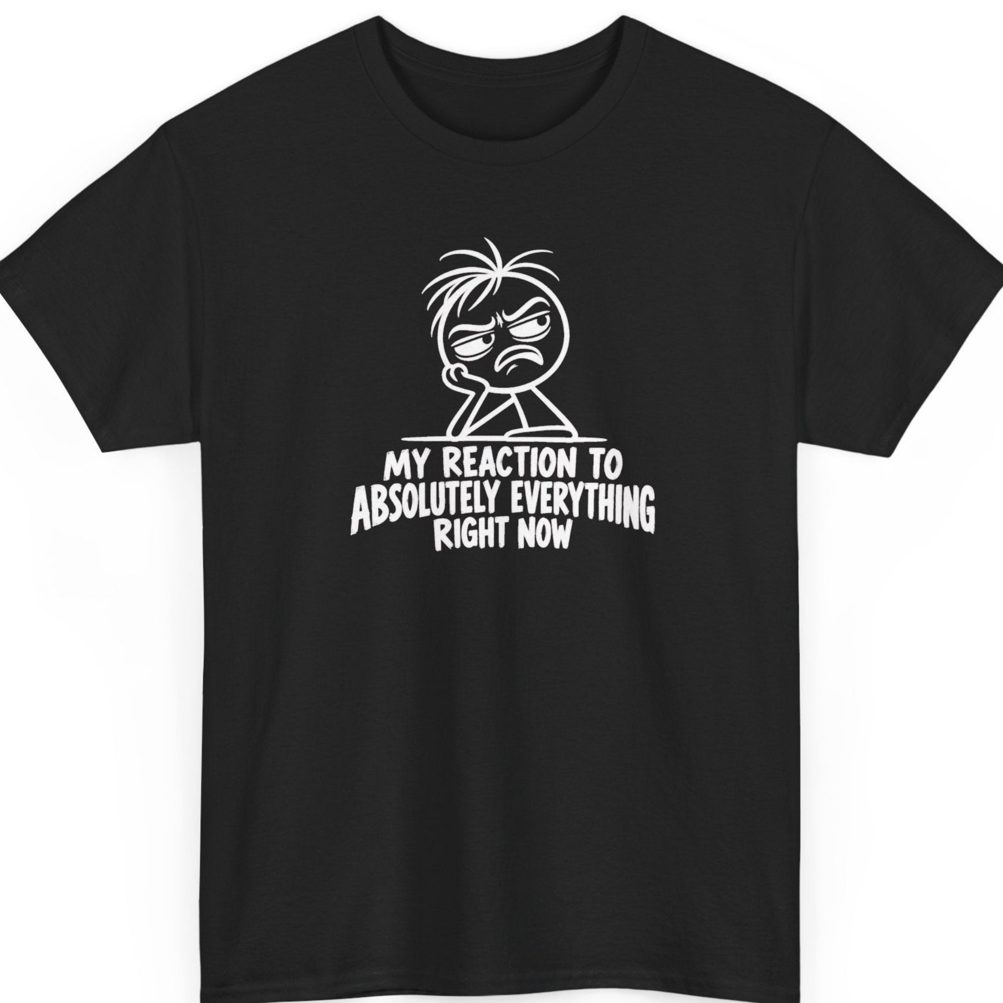 Mayhem Haus “My Reaction to Absolutely Everything Right Now” black t-shirt featuring a white cartoon stick figure with messy hair, narrowed eyes, an exaggerated disgusted frown, and bold distressed typography.