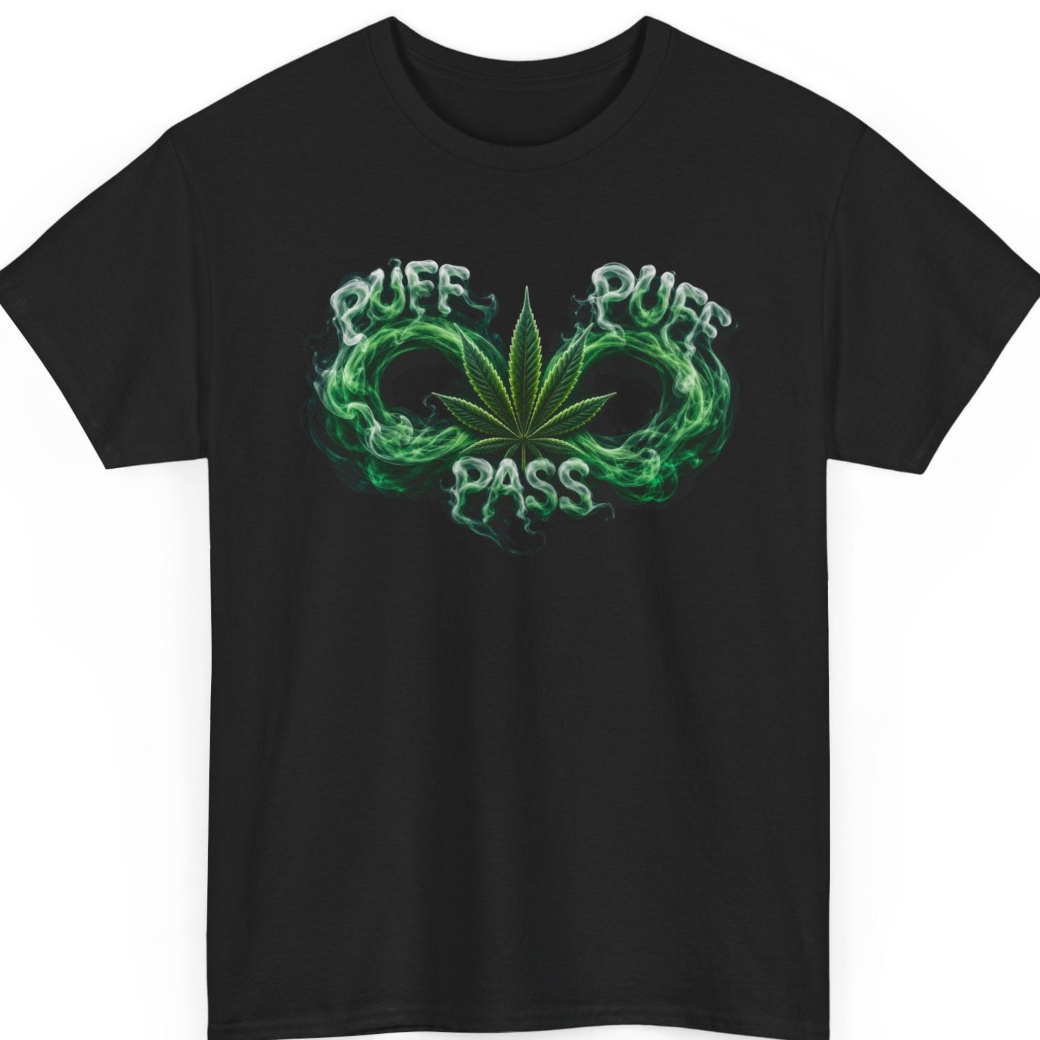 Mayhem Haus cannabis graphic t-shirt on a black shirt featuring a detailed green marijuana leaf surrounded by swirling emerald smoke that forms the words "Puff Puff Pass" in a glowing vapor effect.