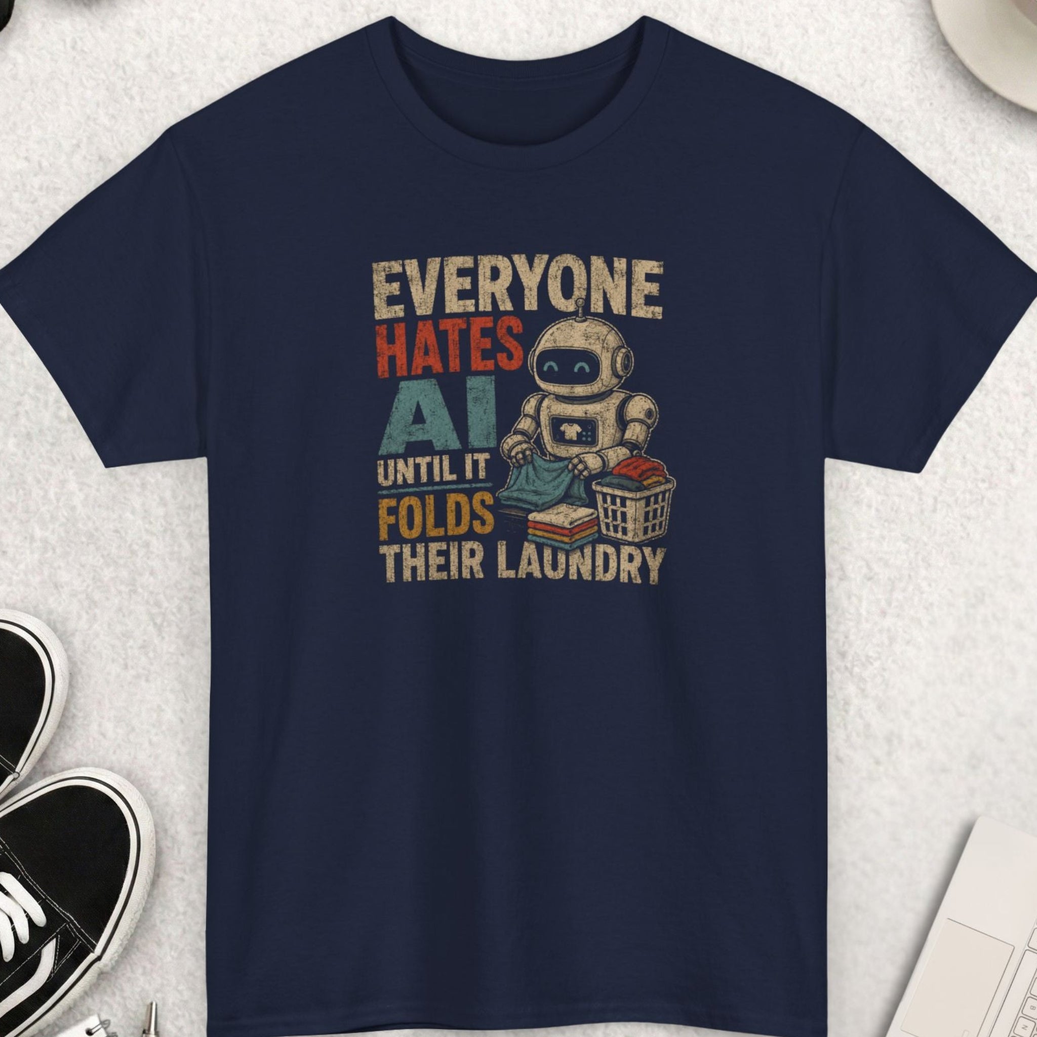 Funny AI humor t-shirt with retro robot folding laundry illustration and distressed text design on navy blue shirt