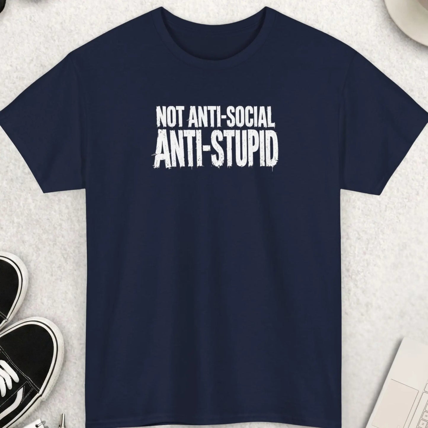 Navy blue sarcastic graphic tee featuring distressed white lettering reading “Not Anti-Social Anti-Stupid” in bold grunge-style typography with an edgy streetwear look.