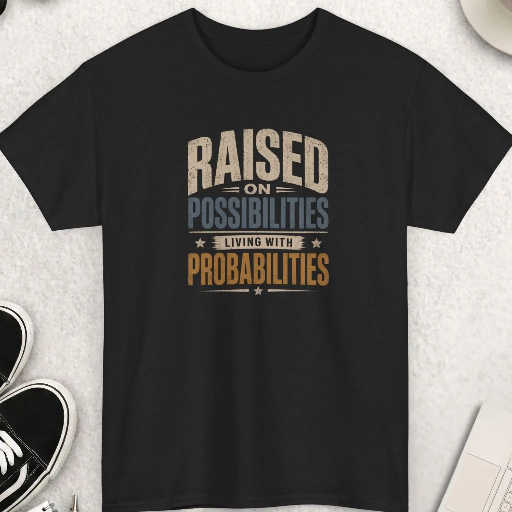 Raised on Possibilities Living with Probabilities t-shirt featuring distressed vintage typography and motivational reality-based message on a black shirt.