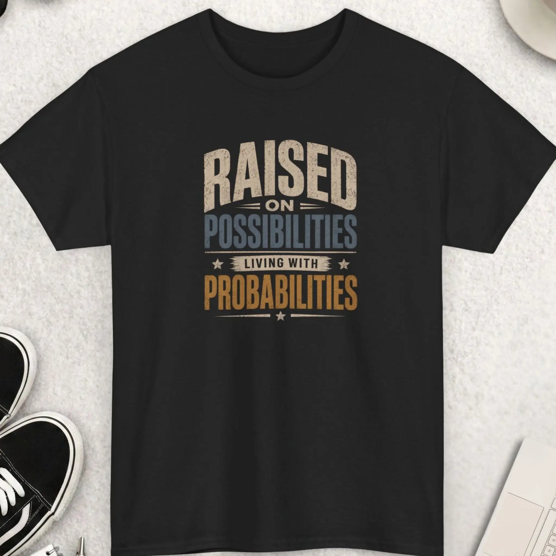 Raised on Possibilities Living with Probabilities t-shirt featuring distressed vintage typography and motivational reality-based message on a black shirt.