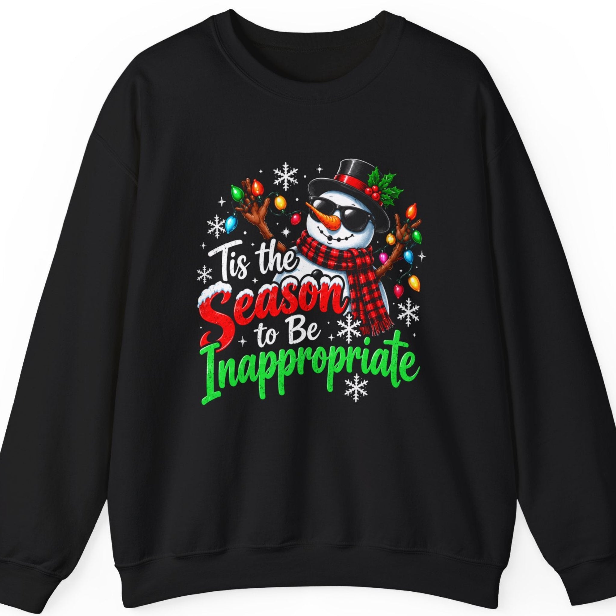 Mayhem Haus “Tis the Season to Be Inappropriate” black sweatshirt featuring a playful snowman wearing sunglasses, a black top hat with holly, and a red plaid scarf. Colorful Christmas lights decorate its raised branch arms, while distressed red, green, and white typography displays the sarcastic holiday phrase “Tis the Season to Be Inappropriate.”
