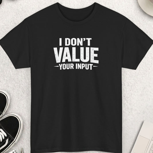 Black t-shirt with 'I Don't Value Your Input' text on a light gray surface with shoes, coffee, and accessories.