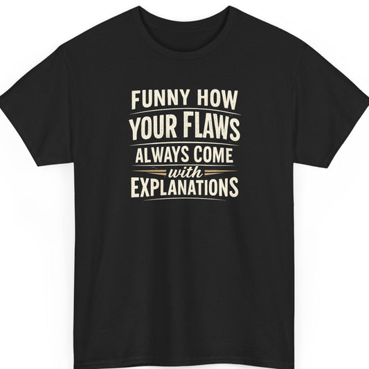 Mayhem Haus "Funny How Your Flaws Always Come with Explanations" typography t-shirt on a black shirt featuring distressed cream vintage lettering in a bold stacked layout.