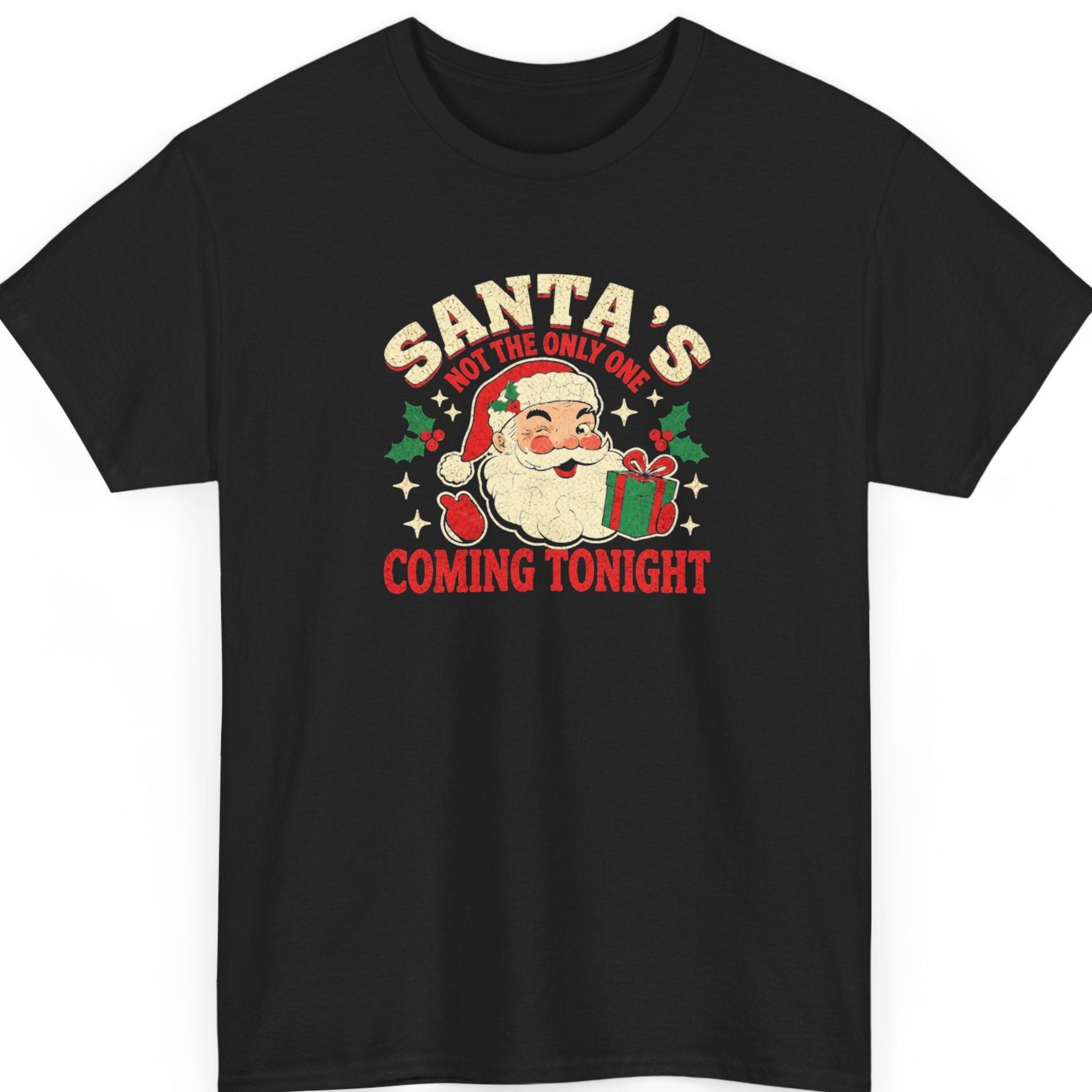 Mayhem Haus “Santa's Not the Only One Coming Tonight” black t-shirt featuring a smiling vintage Santa Claus holding a wrapped Christmas present, surrounded by distressed cream and red typography, holly leaves, berries, and festive stars.