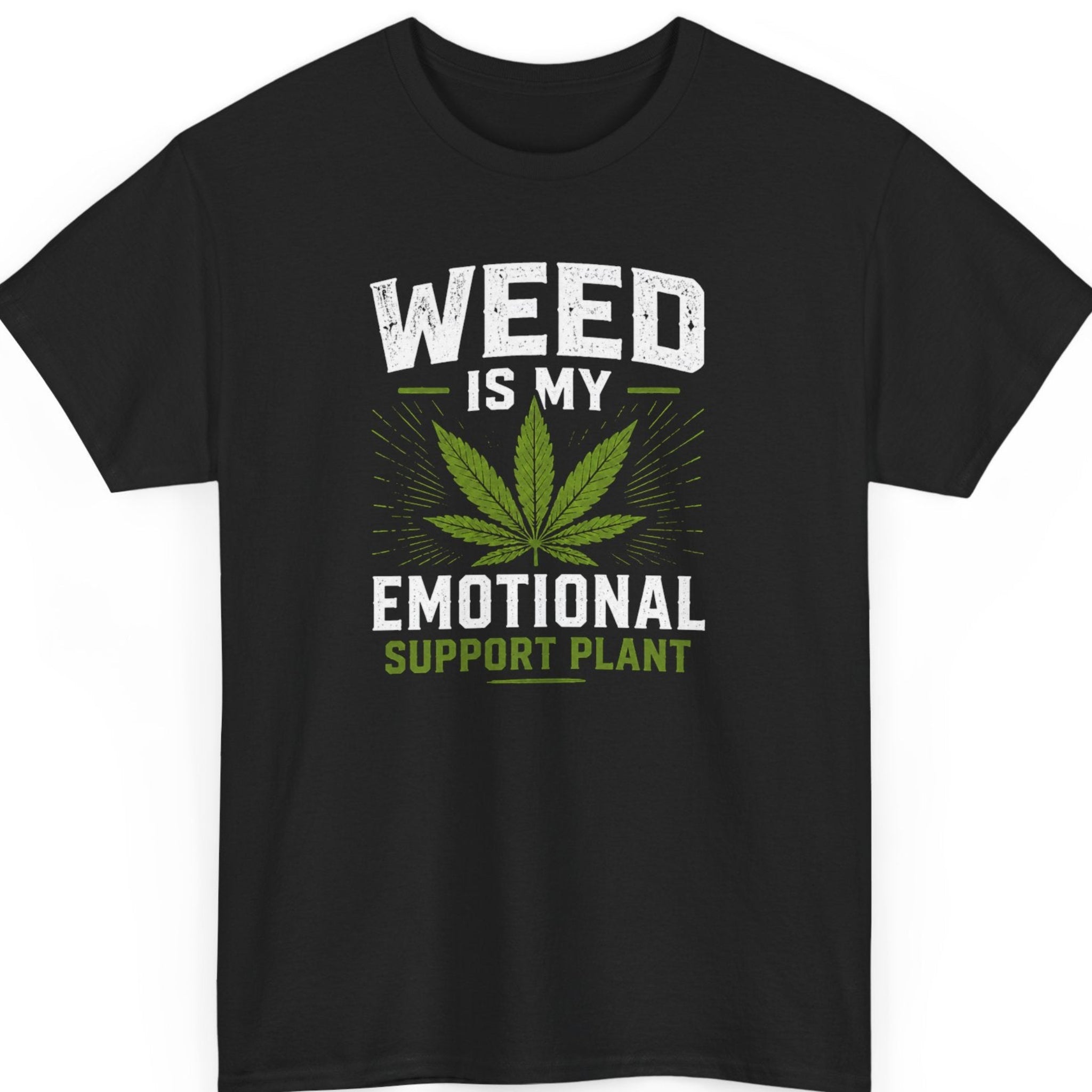 Mayhem Haus cannabis graphic t-shirt on a black shirt featuring a distressed green marijuana leaf with bold white and green typography reading "Weed Is My Emotional Support Plant."
