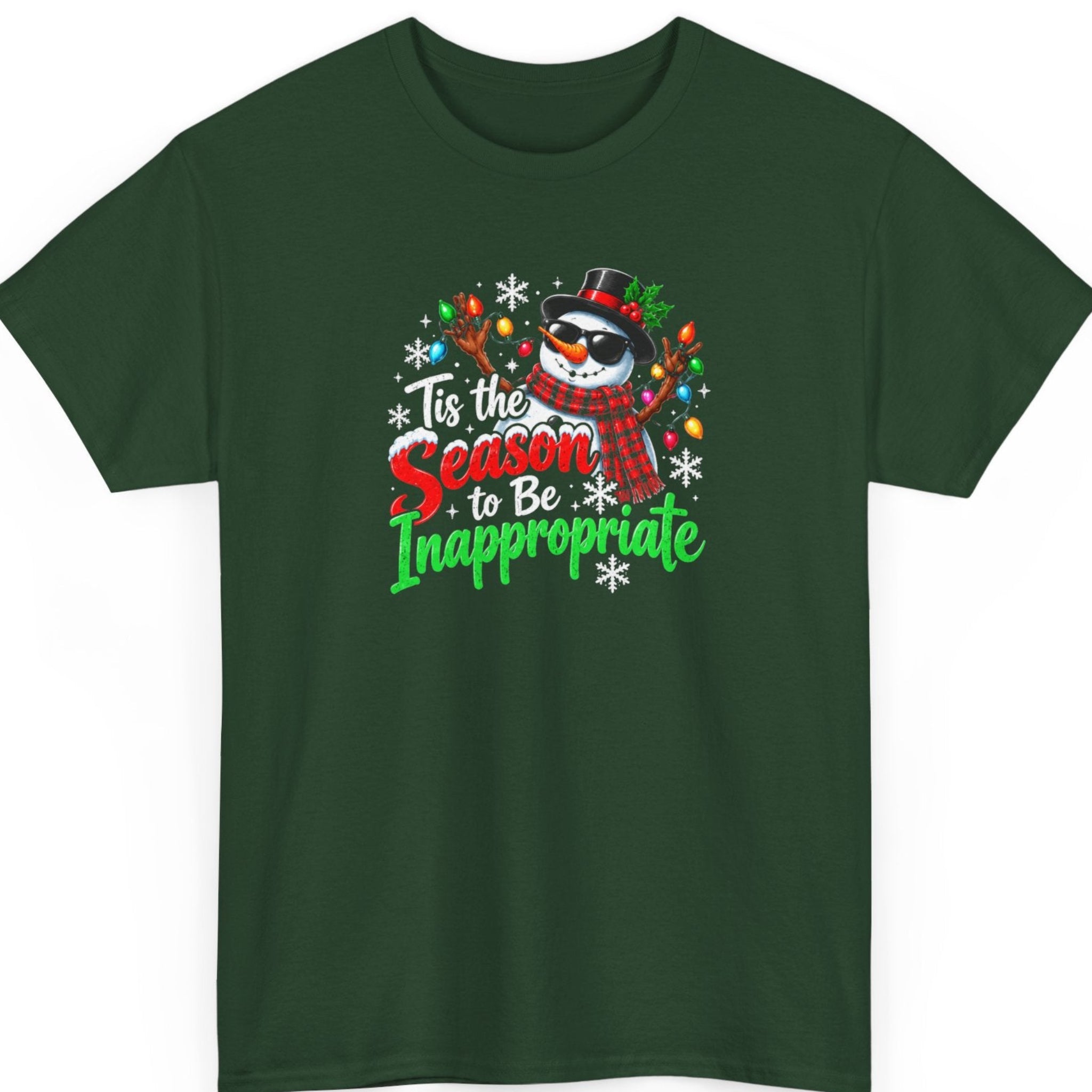 Mayhem Haus “Tis the Season to Be Inappropriate” forest green t-shirt featuring a cool Christmas snowman wearing sunglasses, a black top hat with holly, and a red plaid scarf, surrounded by colorful Christmas lights and white snowflakes. Distressed red, green, and white lettering reads “Tis the Season to Be Inappropriate.”