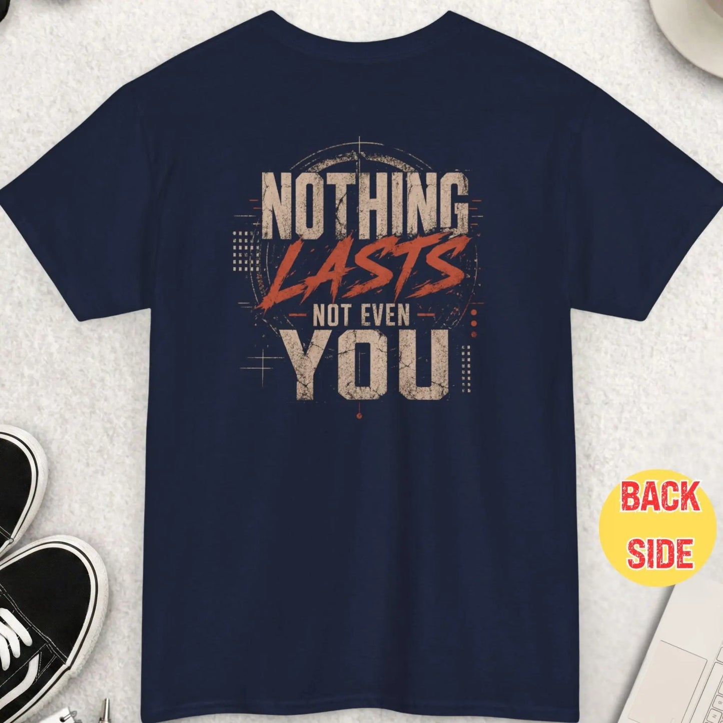 Navy blue t-shirt with a grunge-style distressed design displaying the phrase “Nothing Lasts Not Even You” in bold white and red scratched typography.