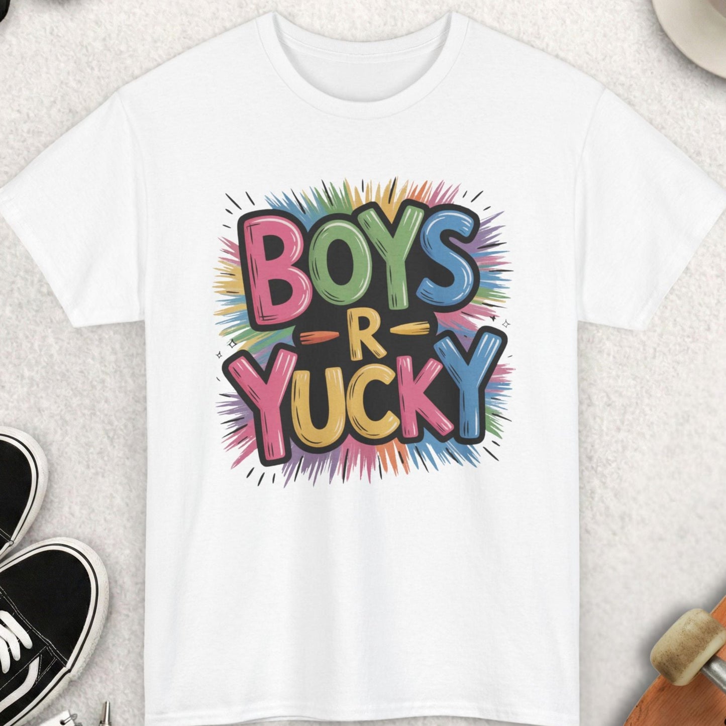 White t-shirt with colorful 'Boys R Yucky' design on a light gray surface with accessories.