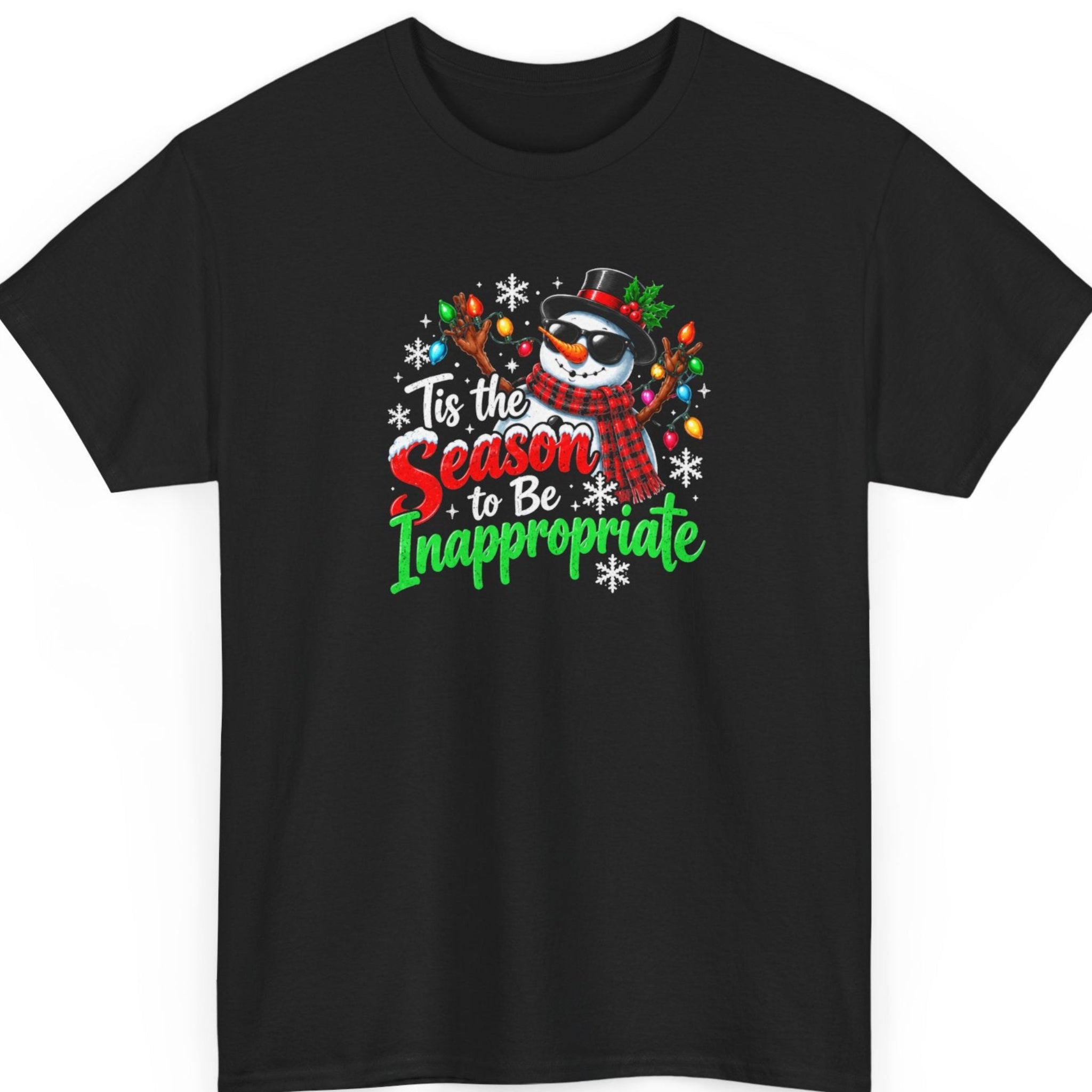 Mayhem Haus “Tis the Season to Be Inappropriate” black t-shirt featuring a mischievous Christmas snowman wearing black sunglasses, a black top hat, and a red plaid scarf, with colorful Christmas lights wrapped around its branch arms. Bold red, green, and white festive lettering and decorative snowflakes complete the humorous holiday design.