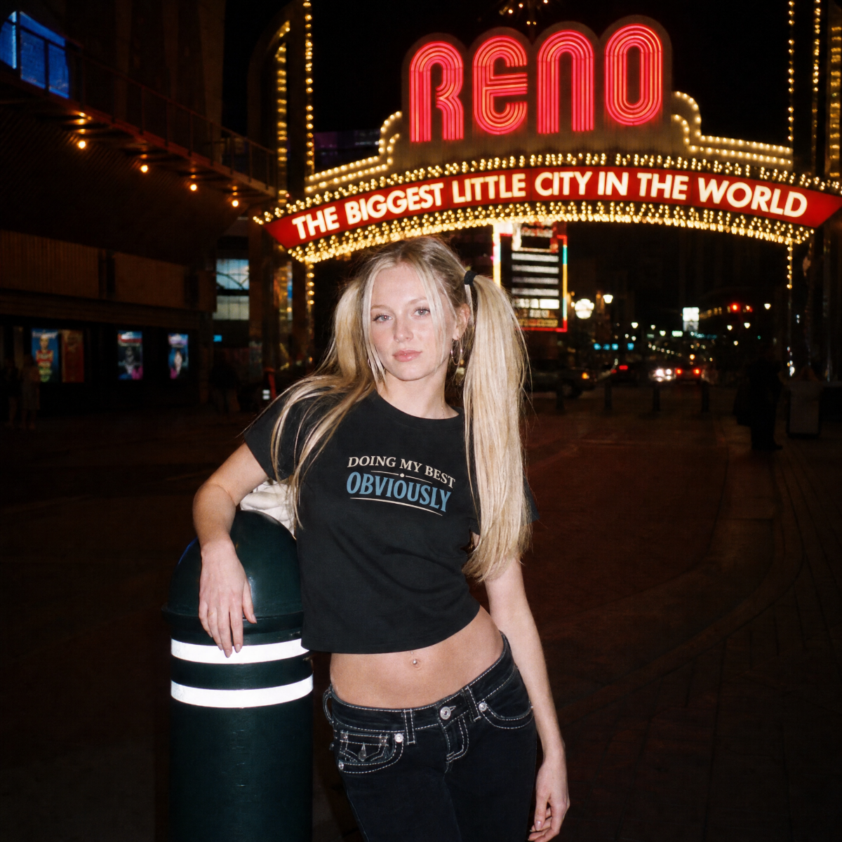 Mayhem Haus Doing My Best Obviously T-Shirt on a model with Reno sign in background