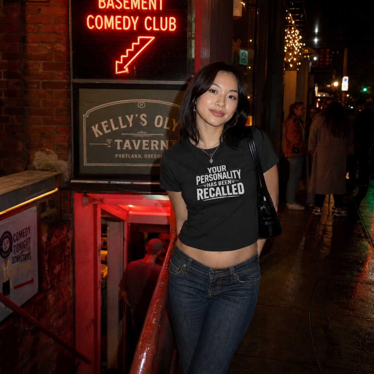Mayhem Haus Your Personality Has Been Recalled T-Shirt worn by a woman outside a comedy club