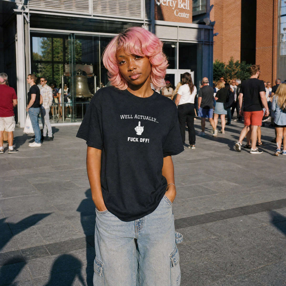 Mayhem Haus Well Actually... F*** Off T-Shirt on a person with pink hair and cargo jeans