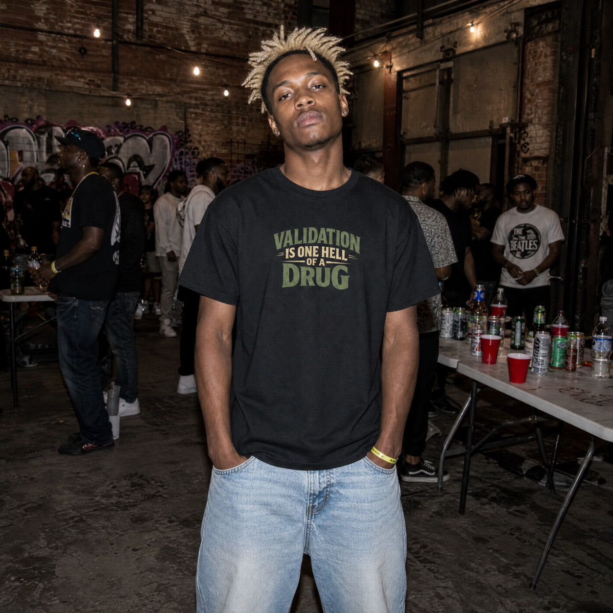 Mayhem Haus Validation Is One Hell Of A Drug T-Shirt on a person with dreadlocks
