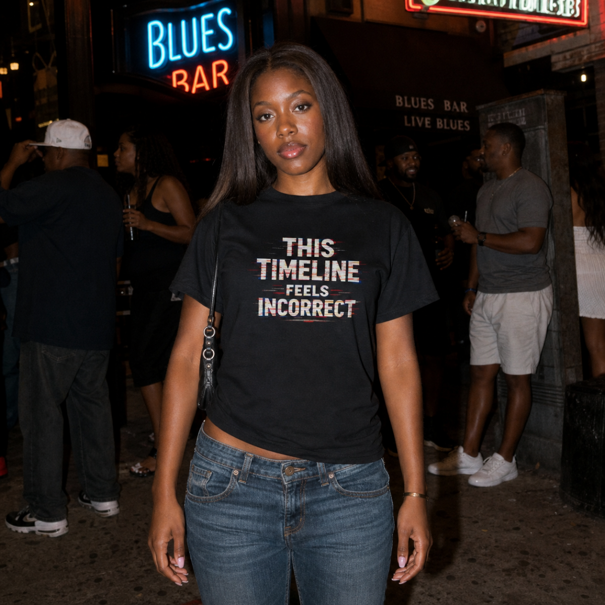 Mayhem Haus This Timeline Feels Incorrect T-Shirt worn by a woman in front of a neon sign
