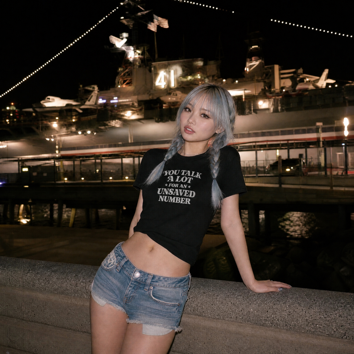Mayhem Haus You Talk A Lot For An Unsaved Number T-Shirt on a model with light blue braids