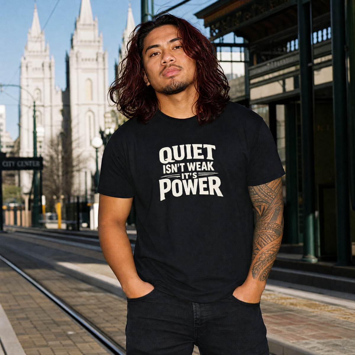 Mayhem Haus Quiet Isn't Weak — It's Power T-Shirt on a man with long hair and tattoos
