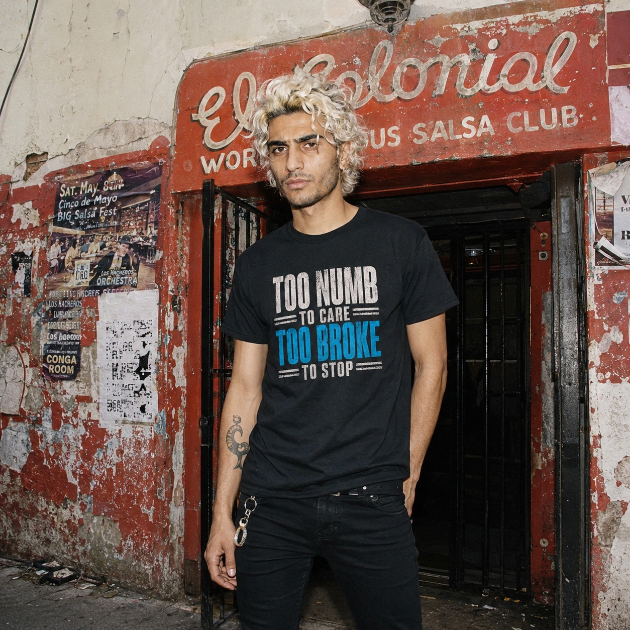 Mayhem Haus Too Numb To Care Too Broke To Stop T-Shirt on a man with bleached hair